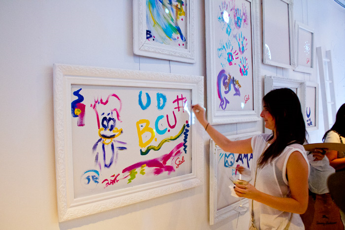 Paint Party: a guest adding their creative touch to the framed canvases #PreppyPlanner